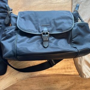 Large Burberry diaper bag. Black with classic Burberry print on the inside.